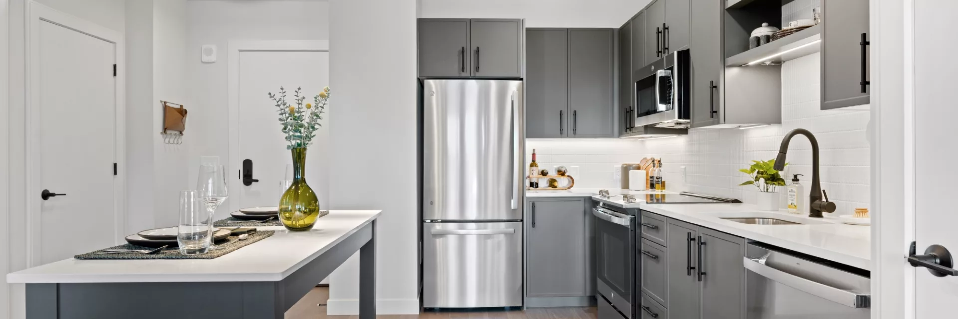 Shaker-style soft-close kitchen cabinets and built in trash drawers