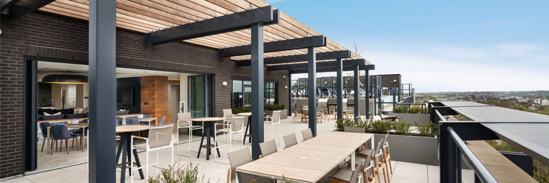 Rooftop at Union Place with seating areas, fire pits, and grilling stations