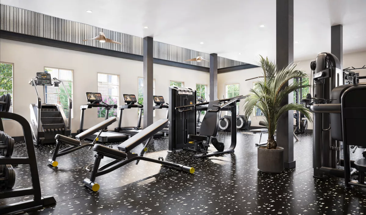 Spacious fitness center with modern cardio machines, weight benches, strength equipment, large windows, and terrazzo-style flooring.