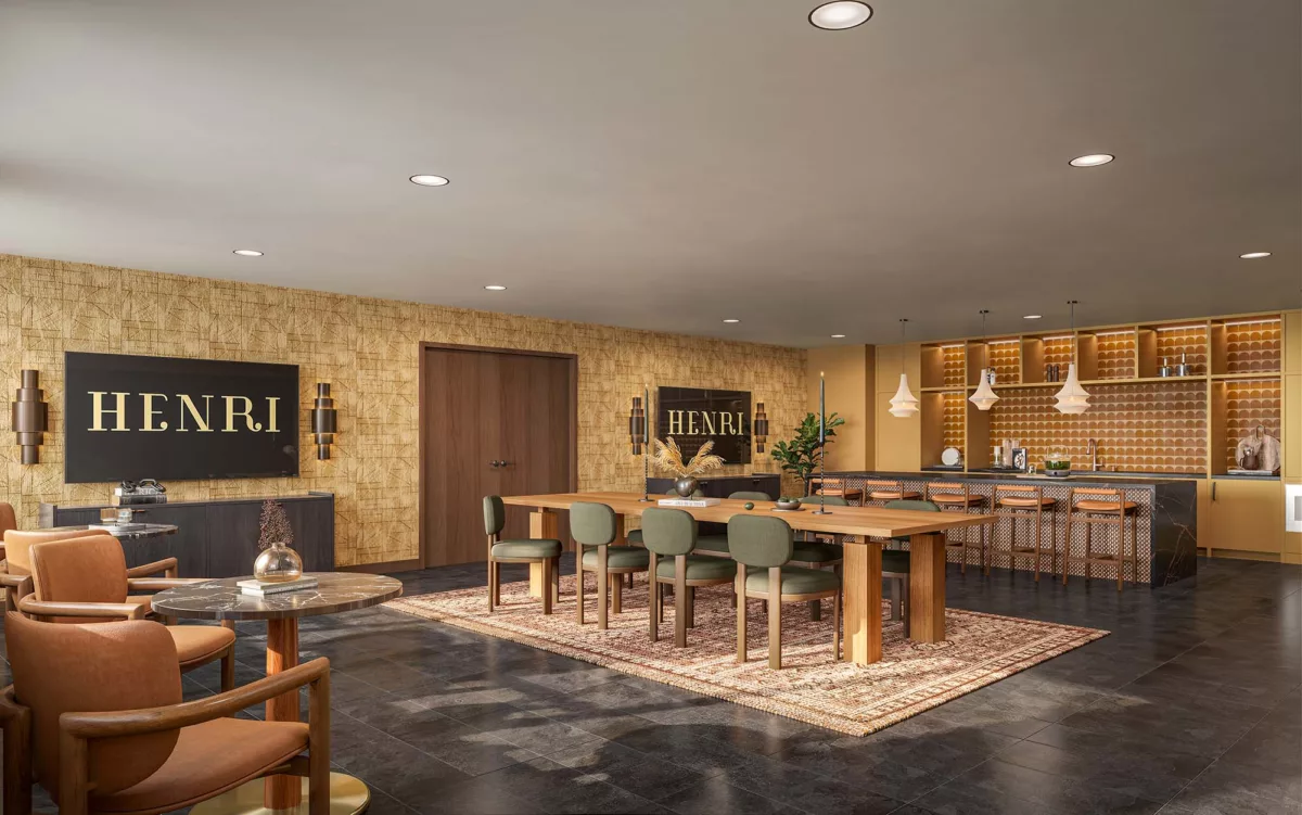 Warm lounge with dining table, bar seating, and gold-accented cabinetry.