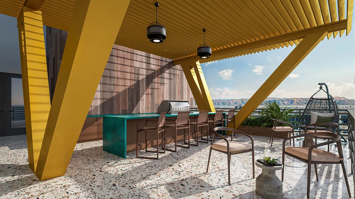 Rooftop patio with yellow pergola, bar seating, and scenic mountain view
