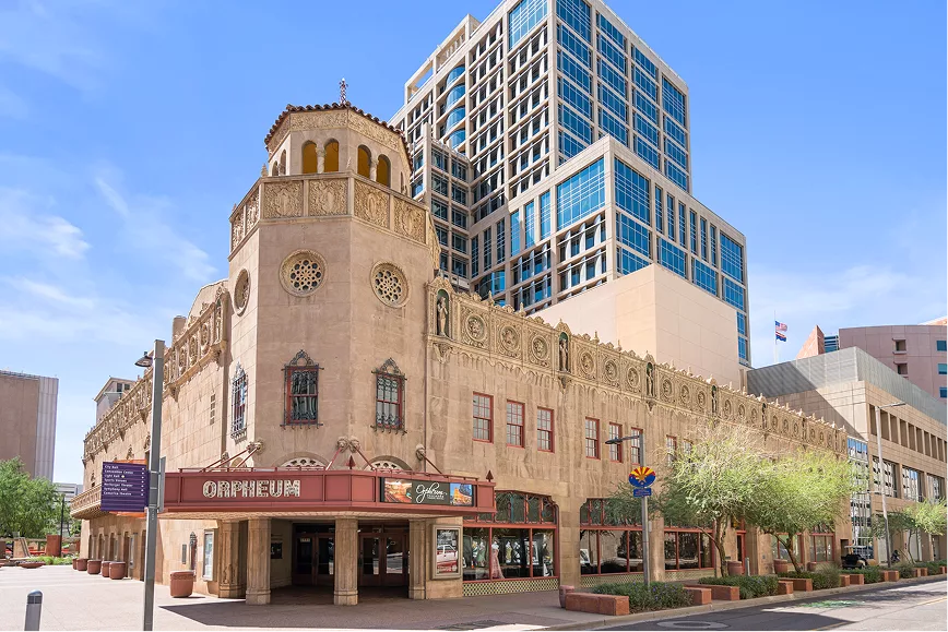 Historic Orpheum Theatre with ornate façade and modern high-rise backdrop
