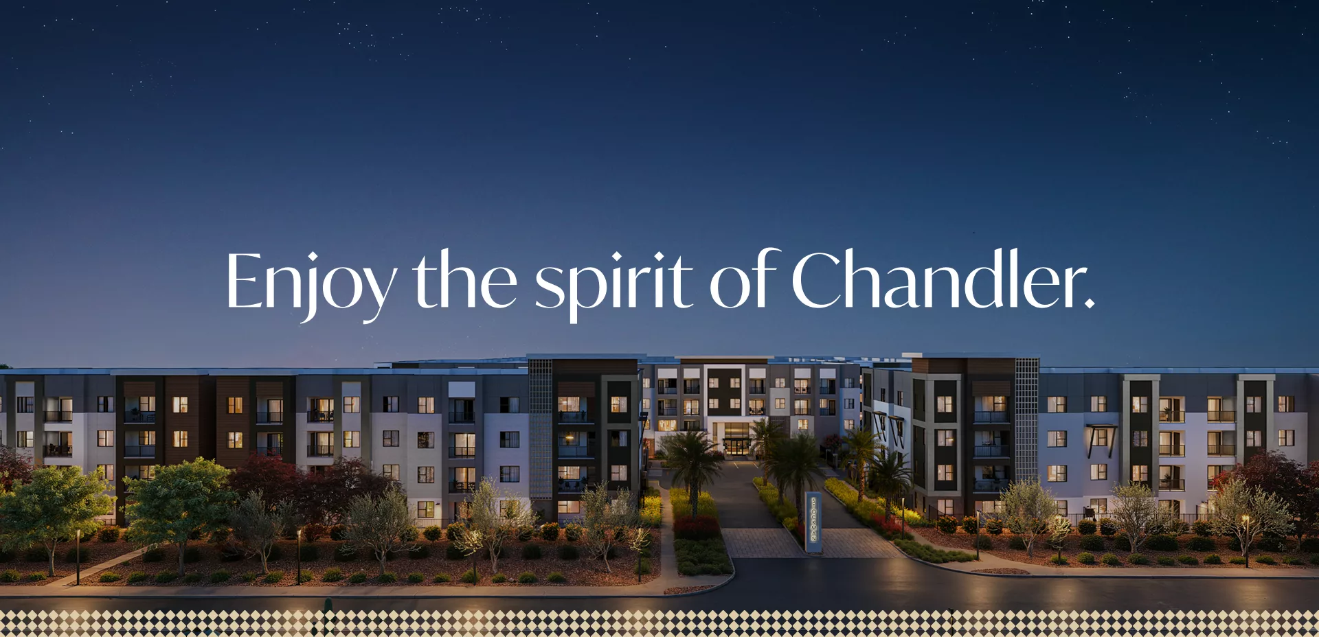 Night view of apartments with text “Enjoy the spirit of Chandler”