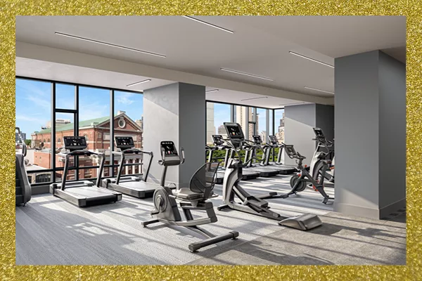 Fitness center with treadmills, bikes, and large windows overlooking city