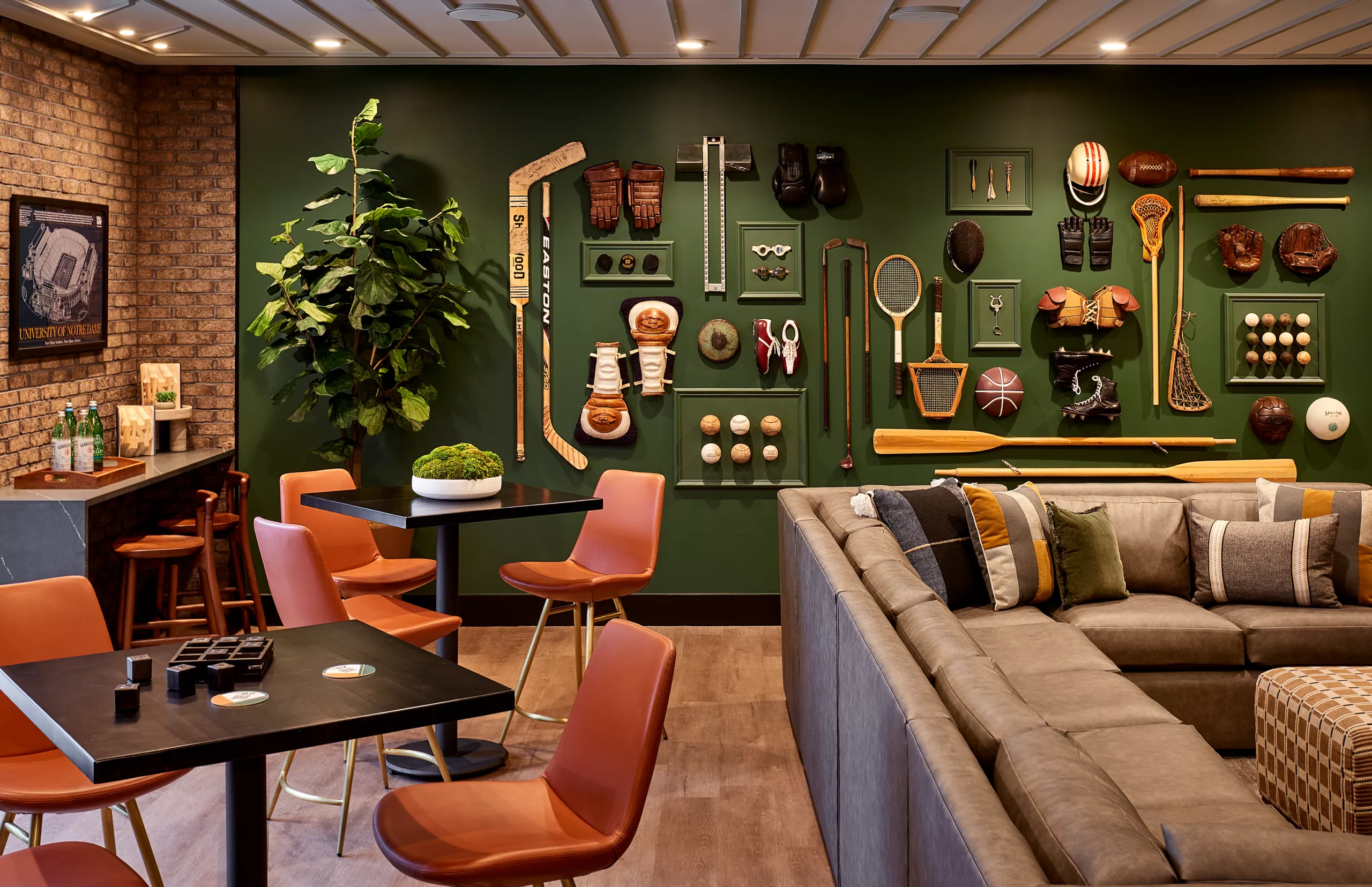 Lounge with sports memorabilia wall and leather seating
