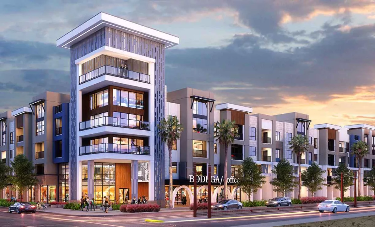 Modern mixed-use apartment complex at dusk featuring bold architectural lines, palm trees, and a retail store labeled “BODY GARAGE” on the ground level.