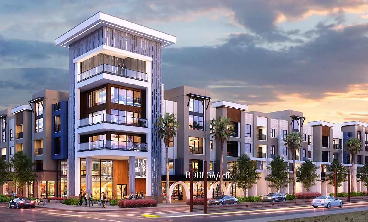 Modern mixed-use apartment complex at dusk featuring bold architectural lines, palm trees, and a retail store labeled “BODY GARAGE” on the ground level.