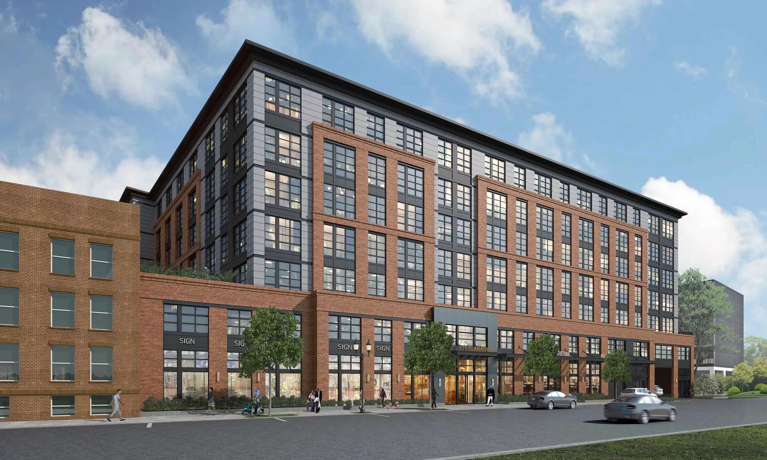 This image shows a modern mid-rise mixed-use building with a combination of red brick and dark gray siding. The structure features large grid-style windows and multiple storefronts at street level labeled “SIGN” and “RETAIL.” The main entrance has a sign above the door that reads “127 SUMMER ST.” indicating the building’s address. The design blends industrial and contemporary styles, and the scene includes pedestrians and vehicles, suggesting an active urban environment.
