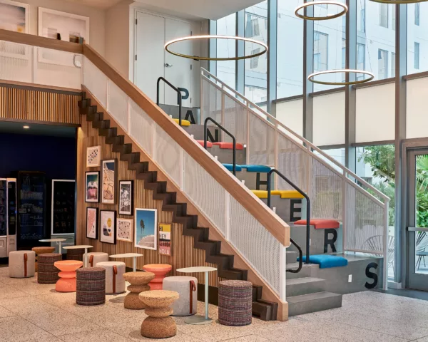 Colorful seating and staircase lounge with “Panthers” lettering on steps