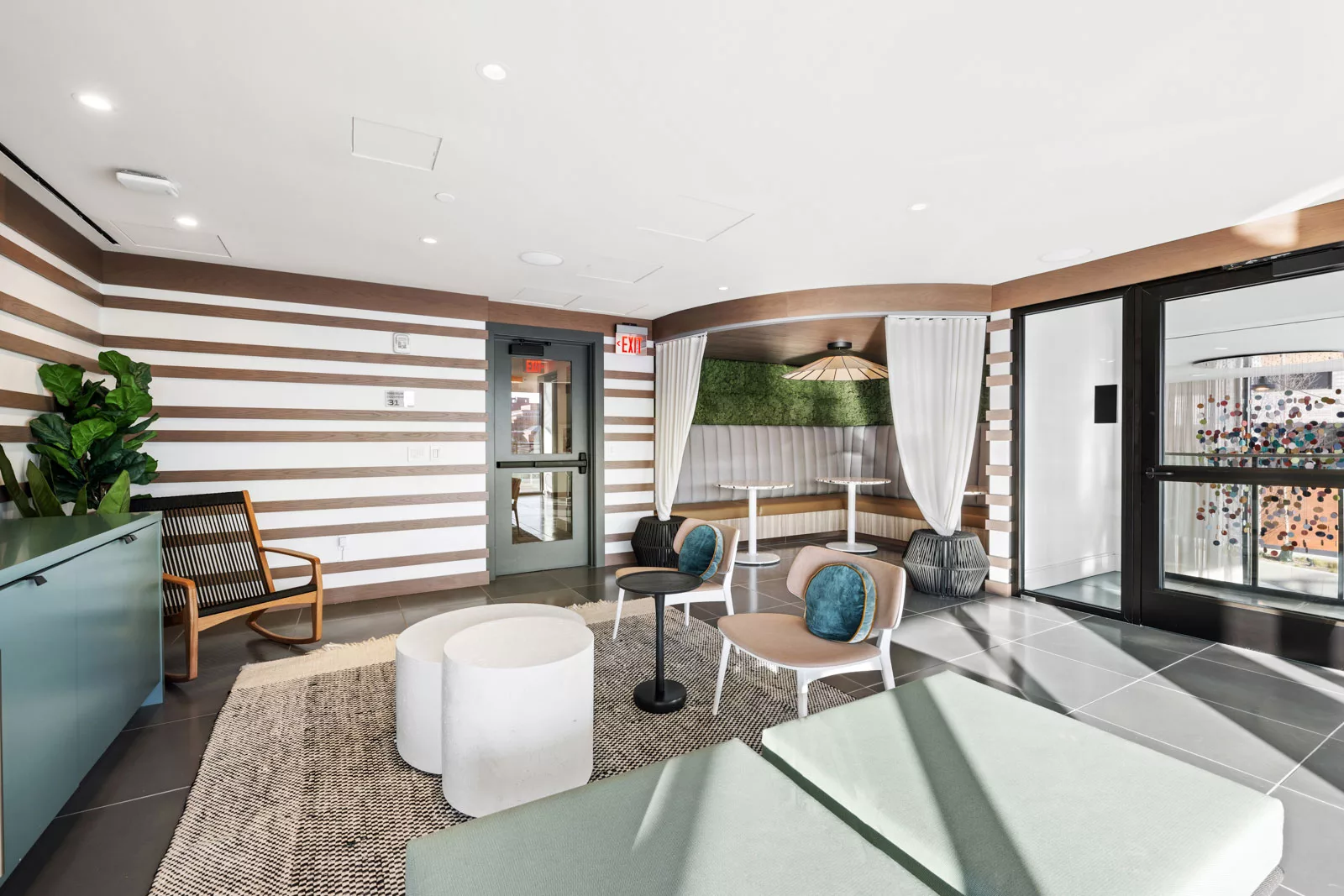 Charis and booth seating in lounge area at Banner Lane