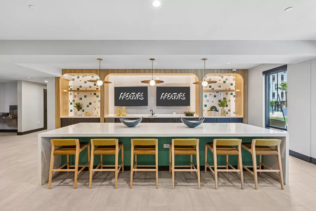 Modern kitchen with island seating and decorative wall shelves