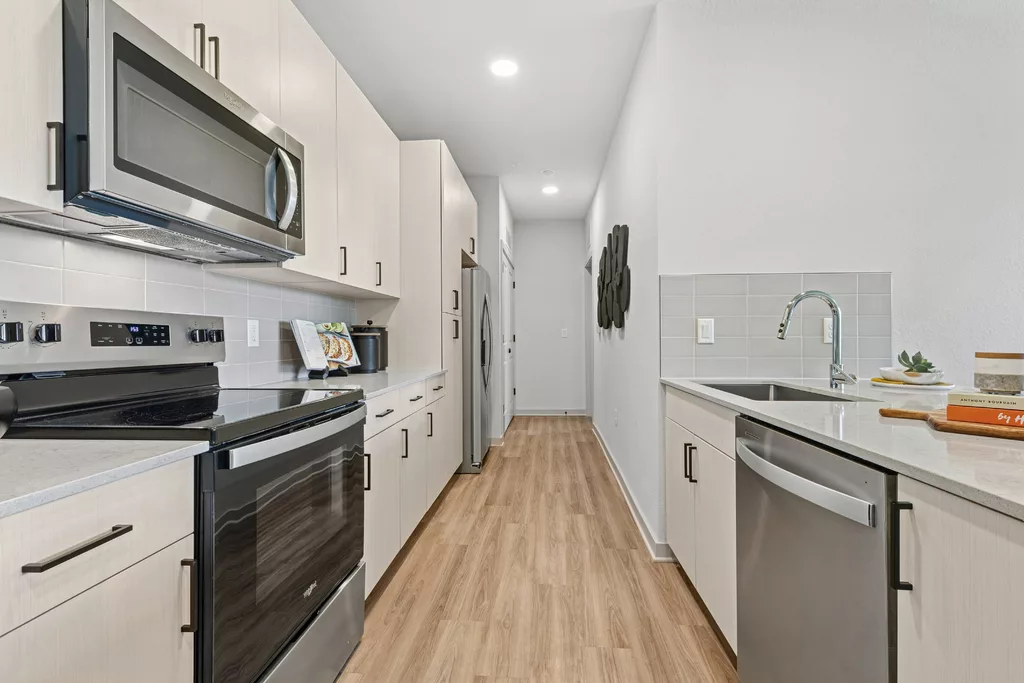 Modern kitchen with island seating and stainless appliances
