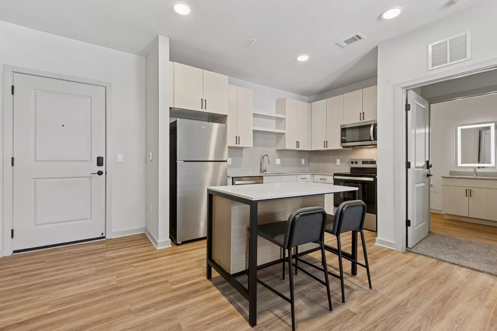 Modern kitchen with island seating and stainless appliances