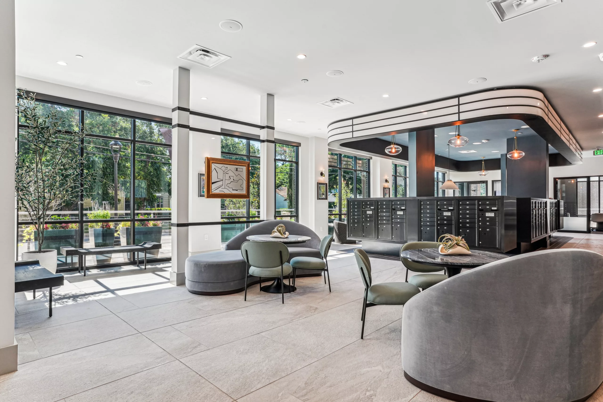 Mailroom lounge with round seating and large windows