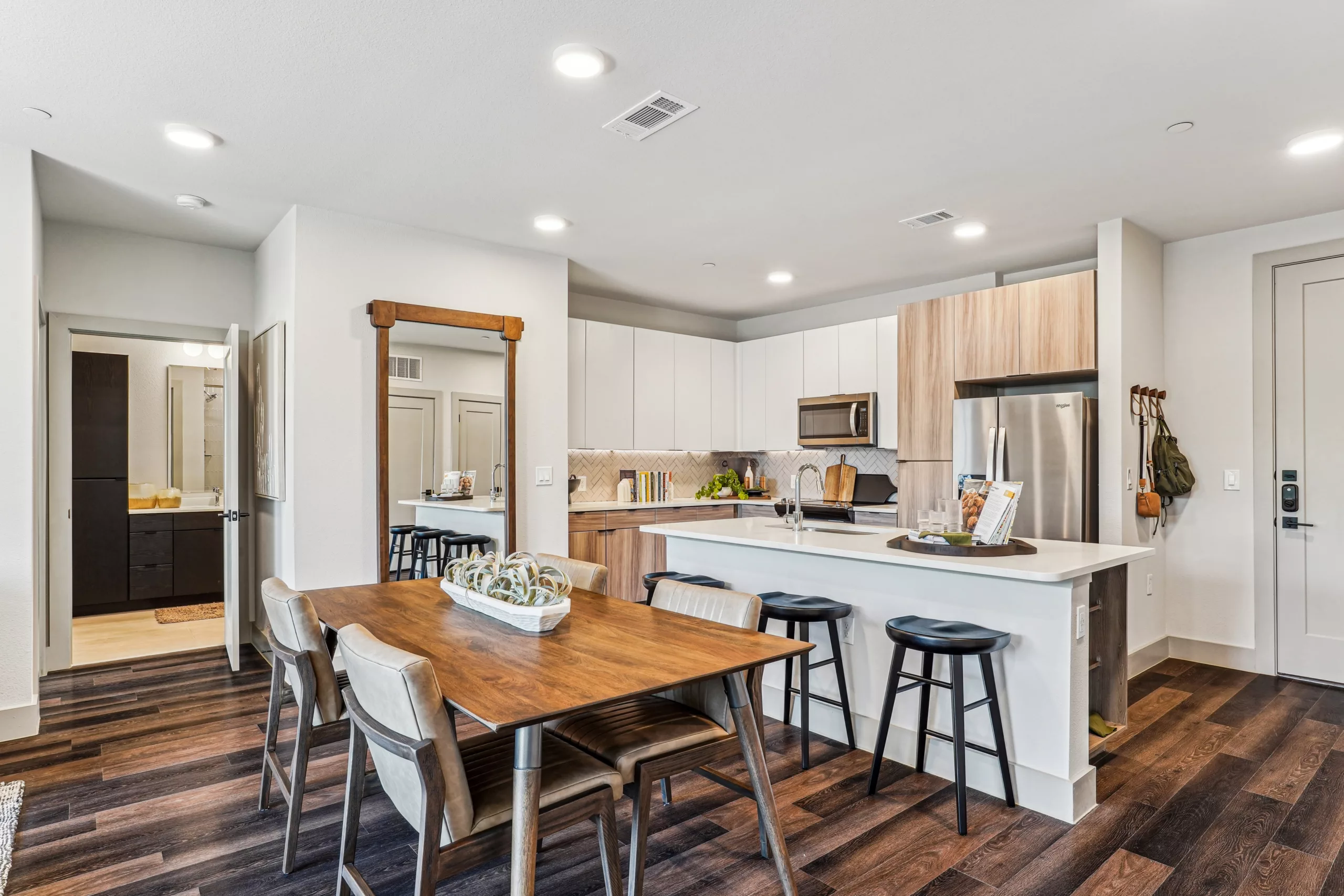 Kitchen and dining area with wood flooring and island seating