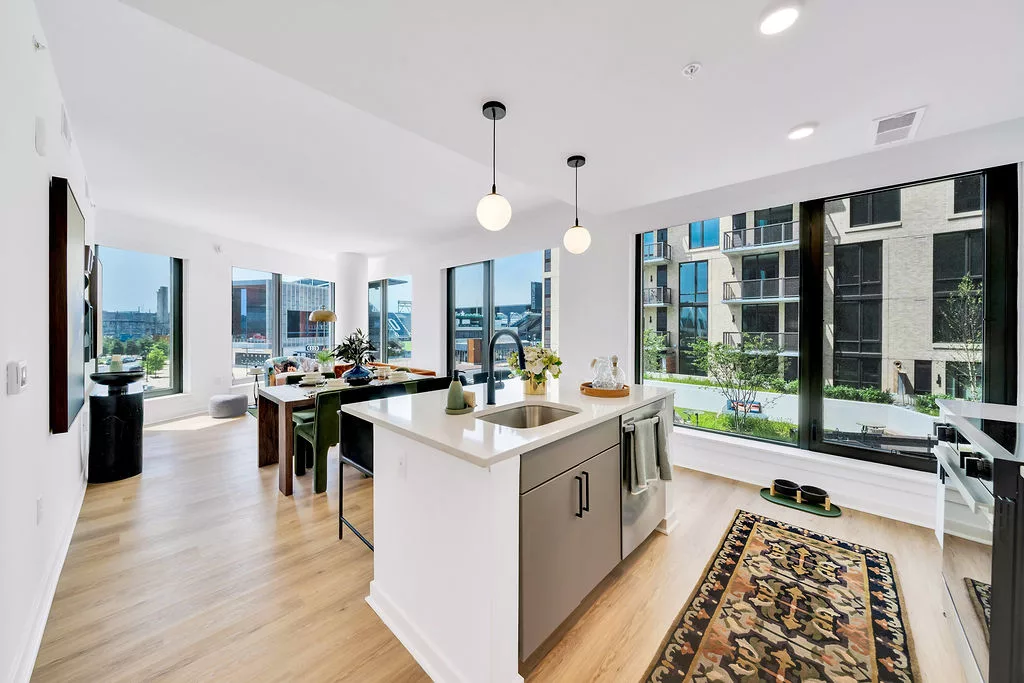 Open kitchen and dining area with large windows and center island