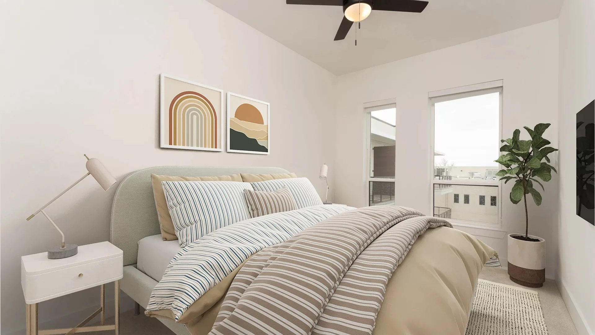 Bedroom with striped bedding, abstract wall art, and large windows