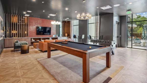 Game room with pool table, foosball, and seating areas