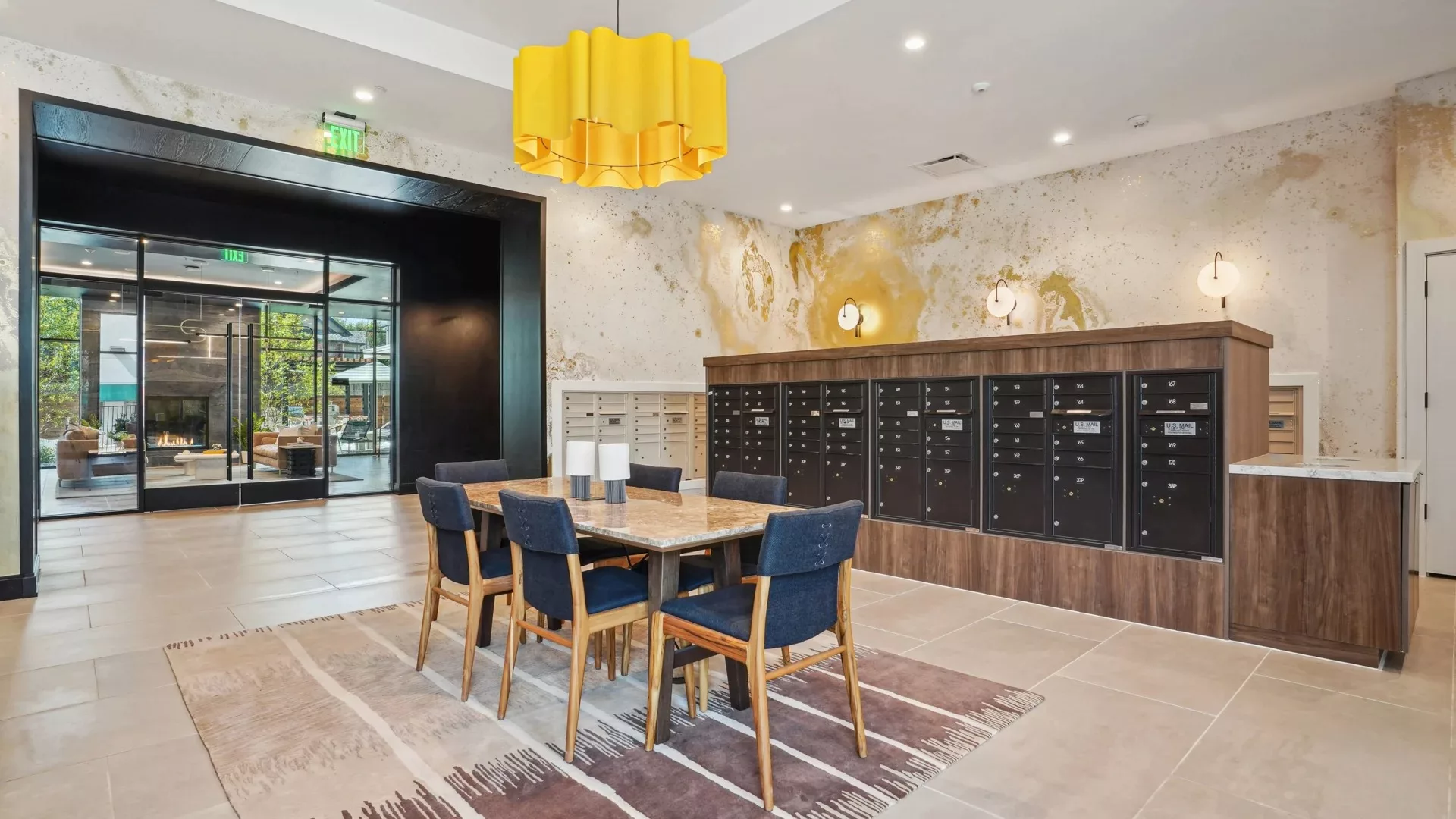 Mailroom with dining table, modern lighting, and wall-mounted mailboxes