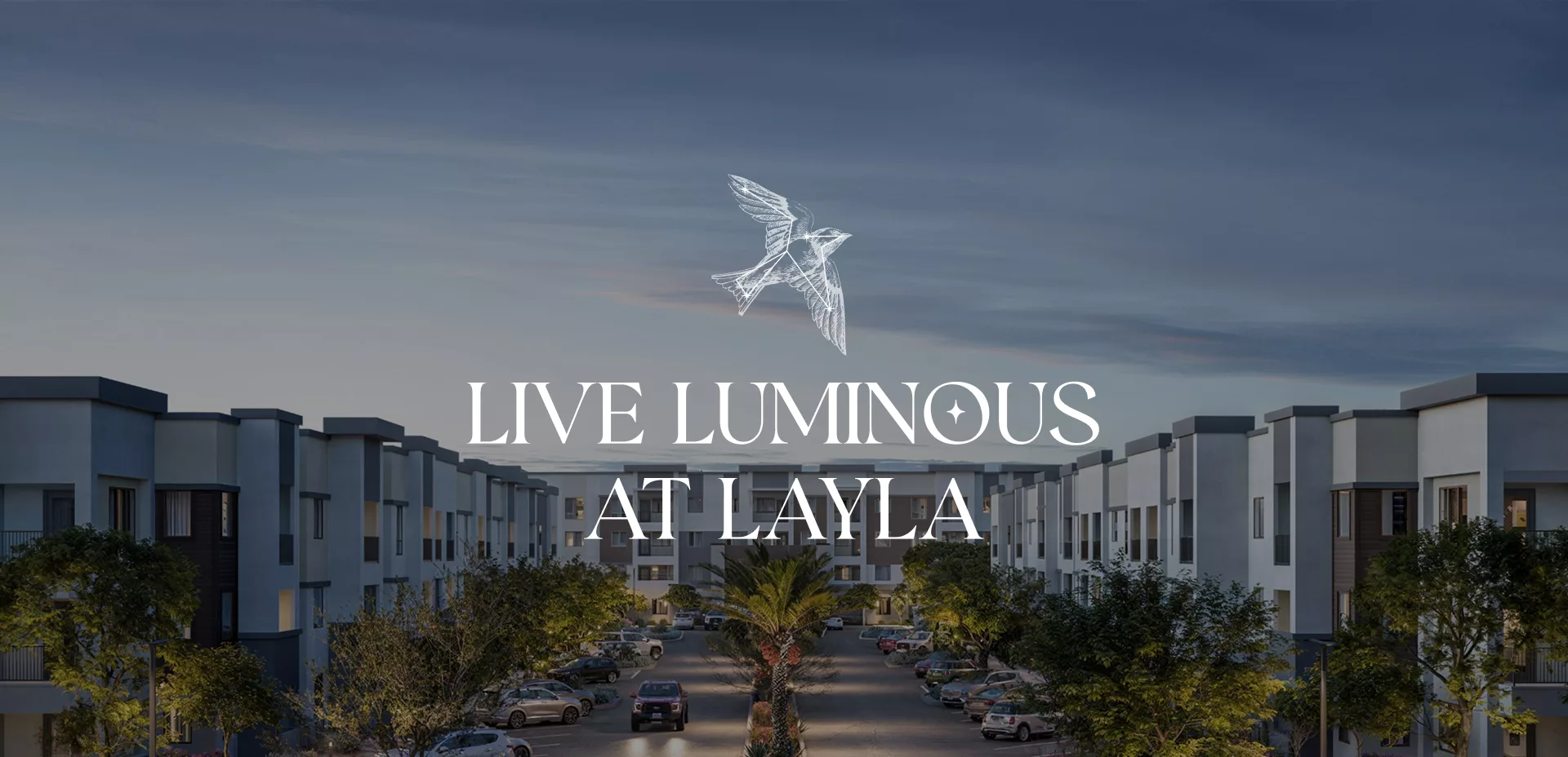 Modern apartment complex with text “Live Luminous at Layla” and bird graphic.