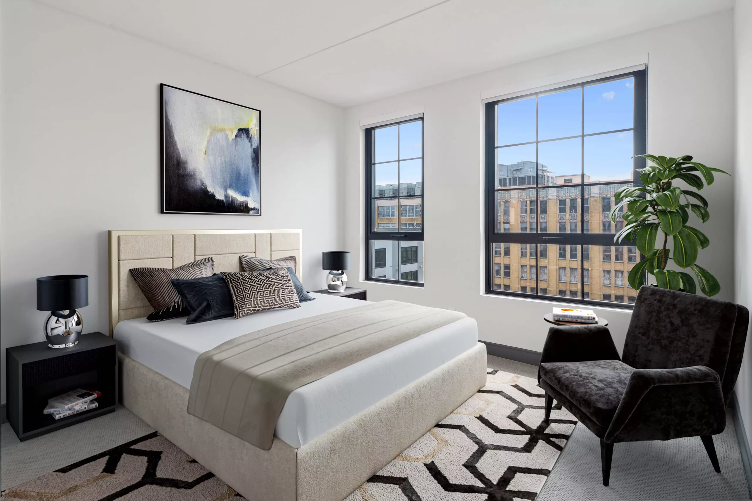 Contemporary bedroom with upholstered bed and large city-view windows